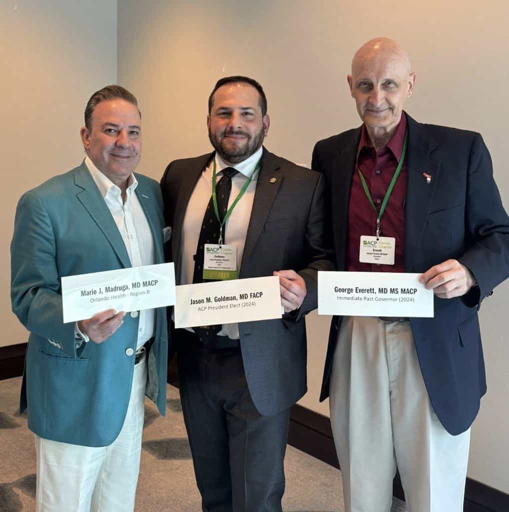 Dr. Jason Goldman with two colleagues at a medical conference