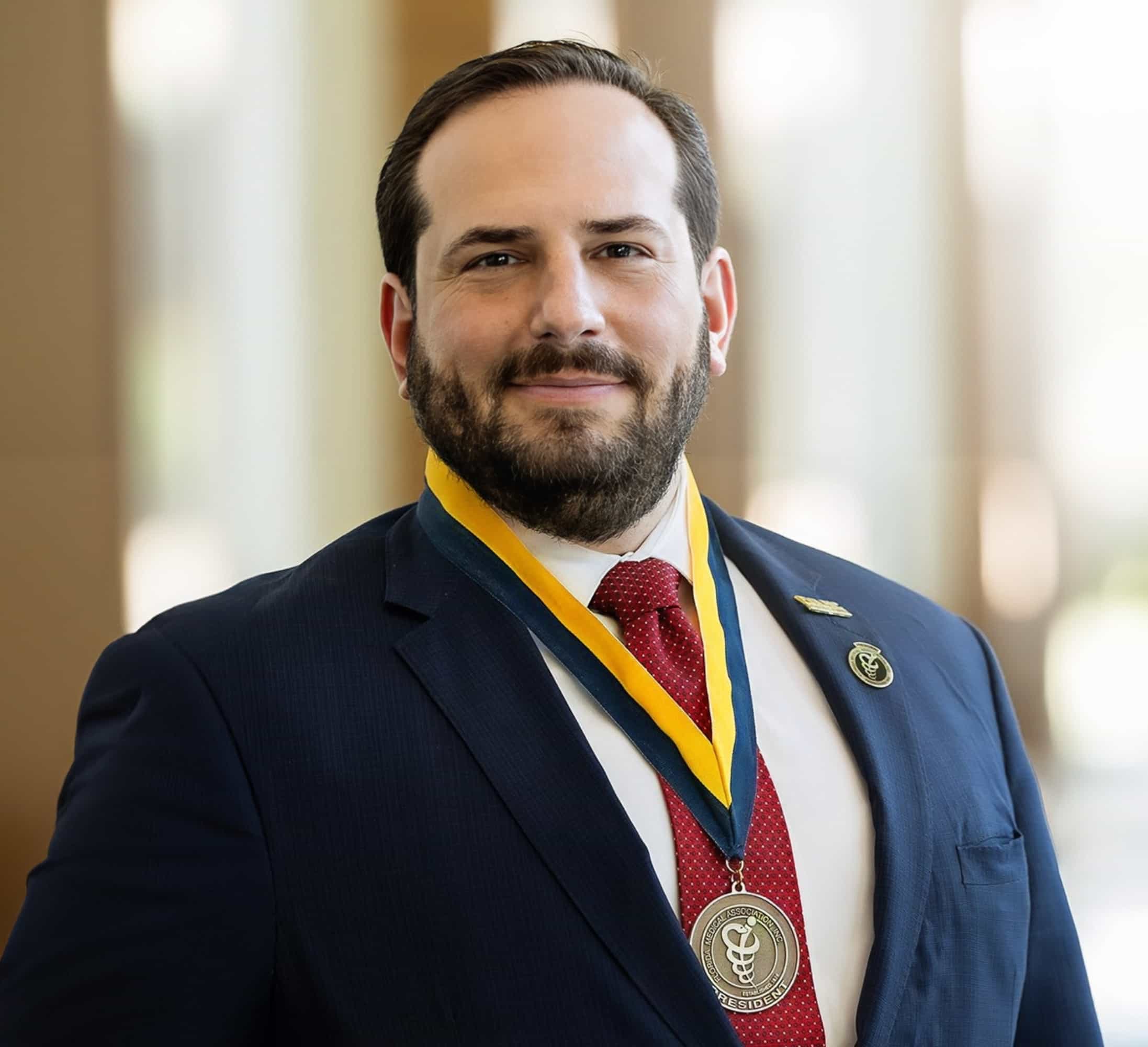 Dr. Jason M. Goldman, MD, FACP, wearing the Florida Medical Association presidential medal